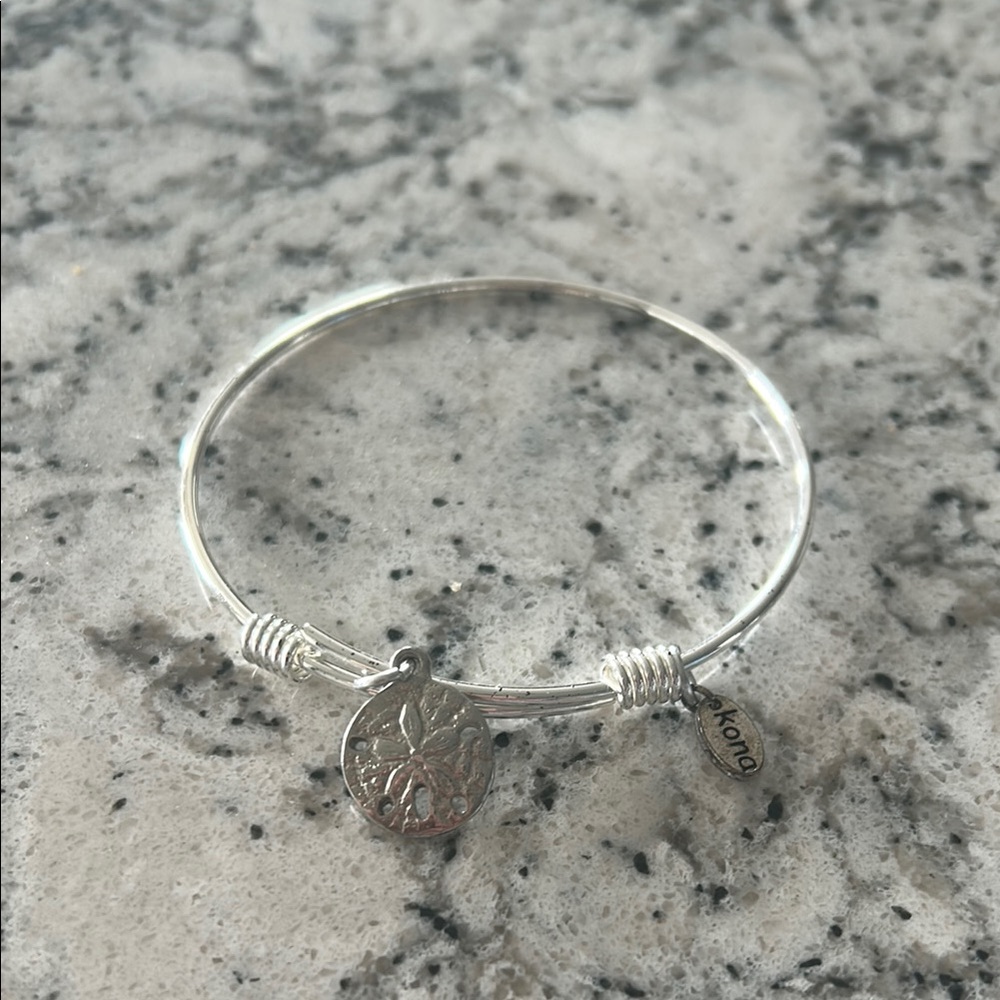 Elegant Silver Bangle Bracelet with Sand Dollar Charm